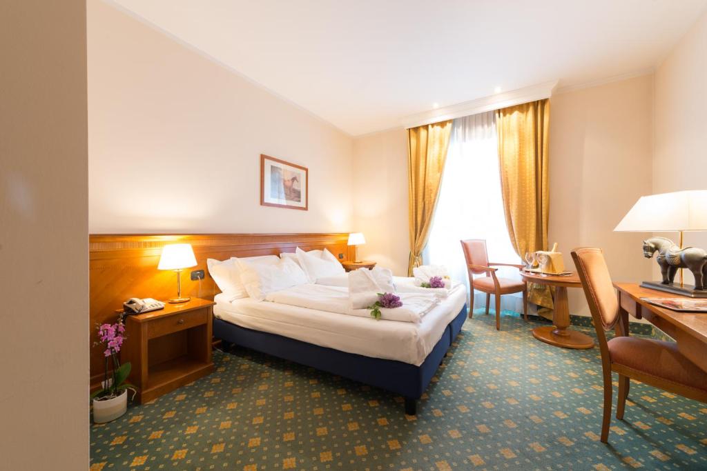 Postel nebo postele na pokoji v ubytování Hotel Eden