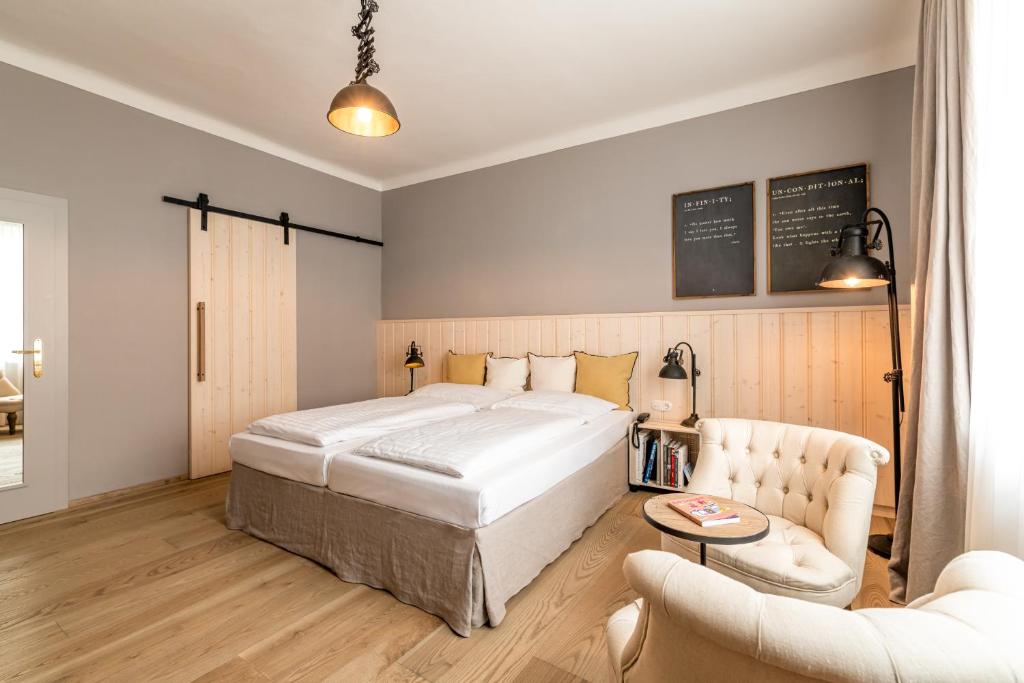 Ein Bett oder Betten in einem Zimmer der Unterkunft Hotel Markus Sittikus Salzburg