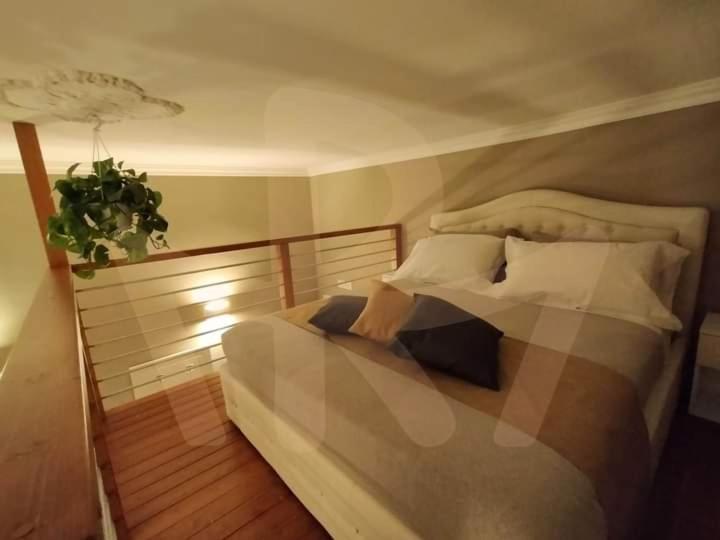 Uma cama ou camas num quarto em La Maison du Relax