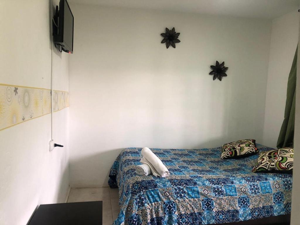 Voodi või voodid majutusasutuse Hostal y Camping Los Girasoles toas