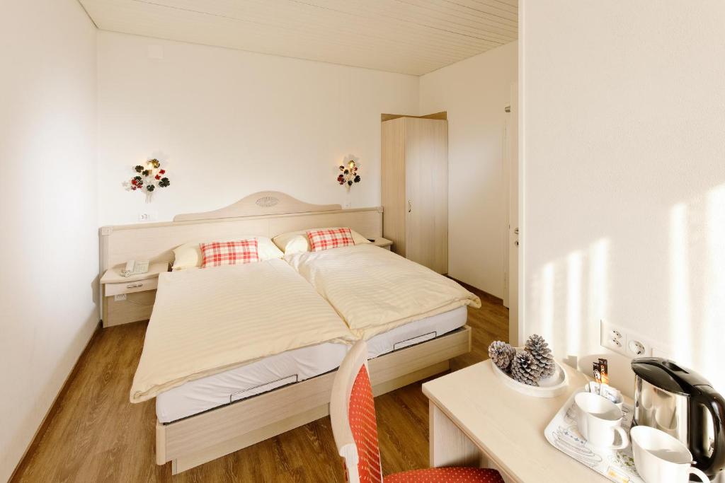 Postel nebo postele na pokoji v ubytování Hotel Beausite
