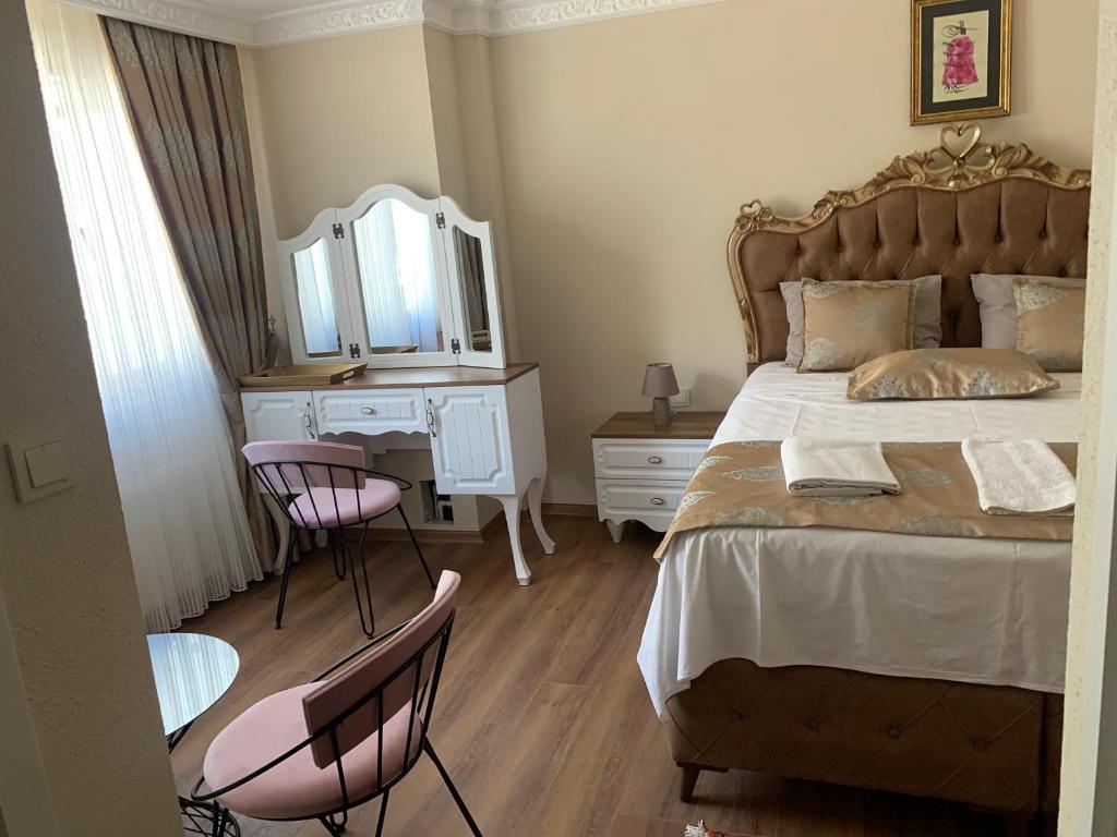 Postel nebo postele na pokoji v ubytování elisa hotel