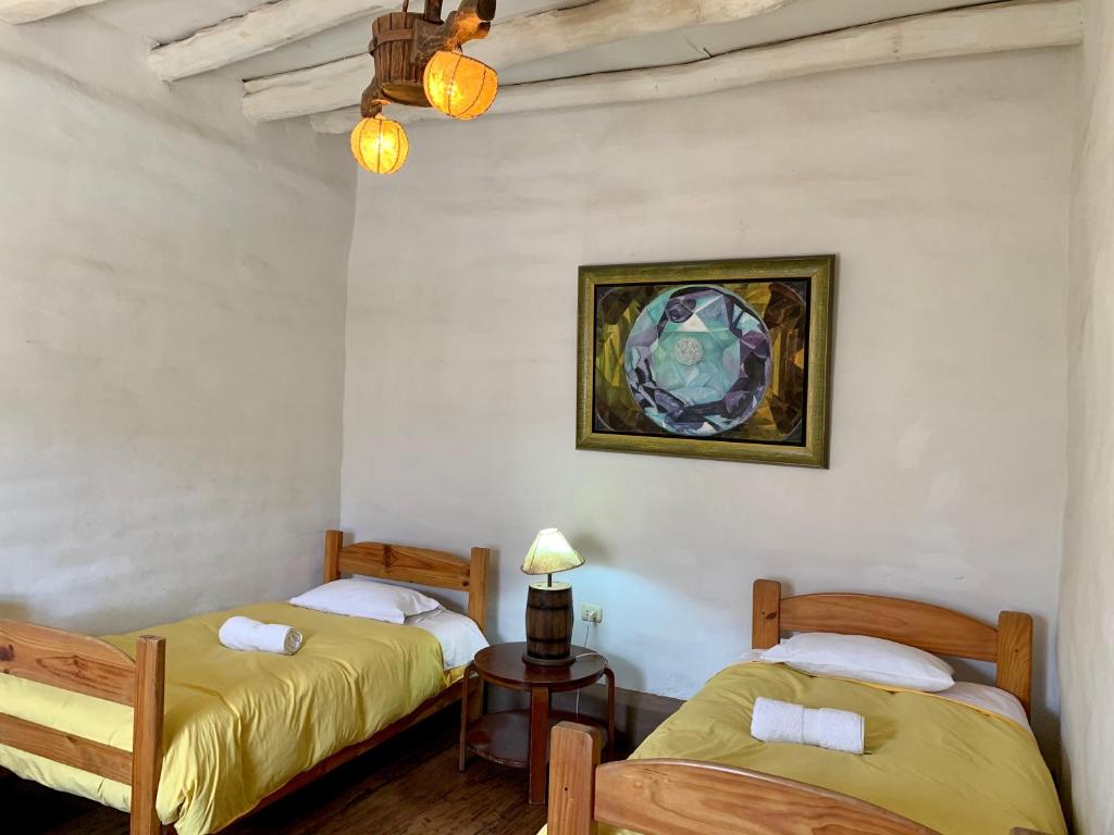 Postel nebo postele na pokoji v ubytování Refugio de Santiago Ecolodge
