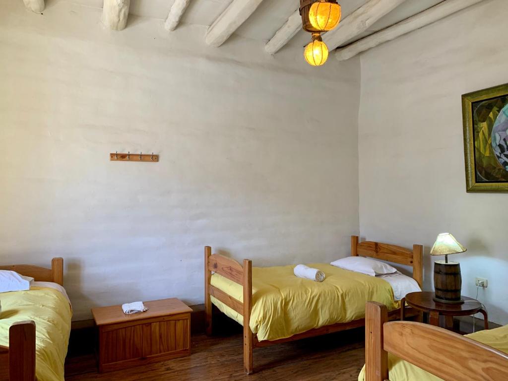 Postel nebo postele na pokoji v ubytování Refugio de Santiago Ecolodge