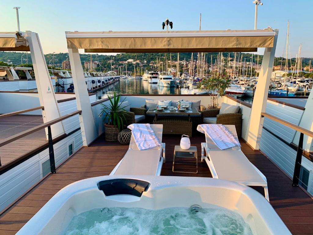 a bath tub on the deck of a boat at Sirena Floating House Portorož in Portorož