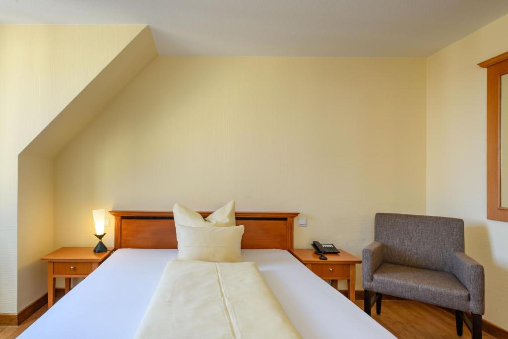 Postel nebo postele na pokoji v ubytování Ringhotel Dreiländereck Zittau