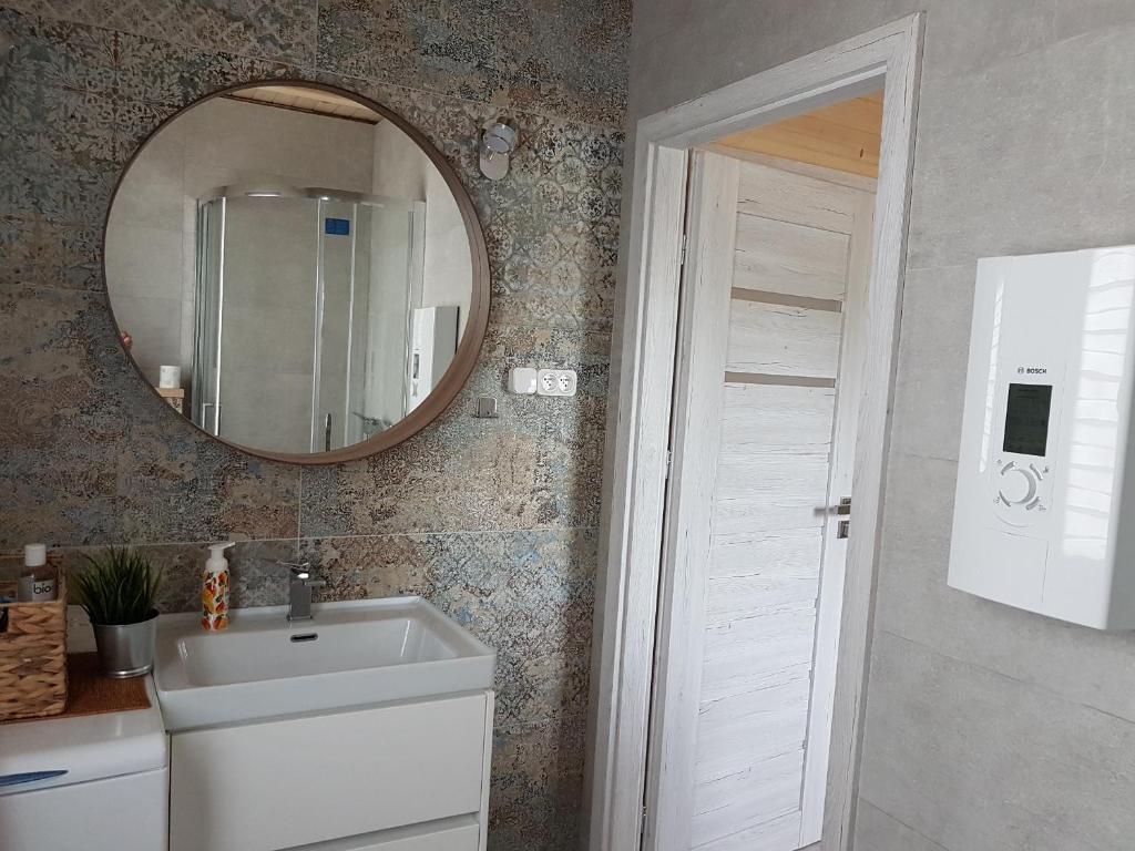 Kúpeľňa v ubytovaní Dom drewniany JULKA