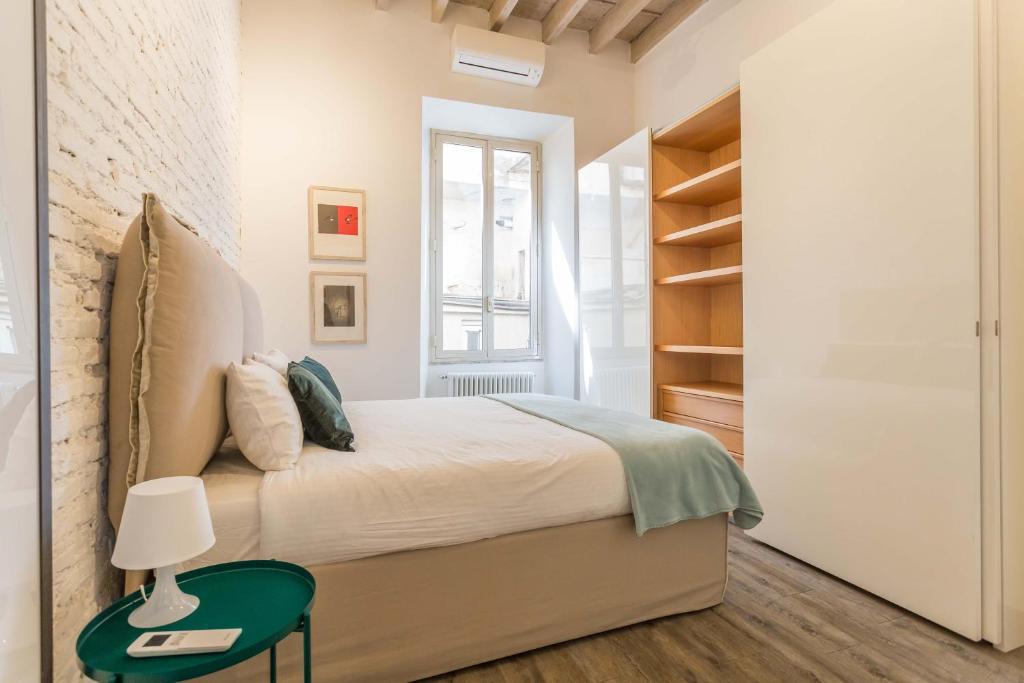 Łóżko lub łóżka w pokoju w obiekcie Casa Manara in Trastevere