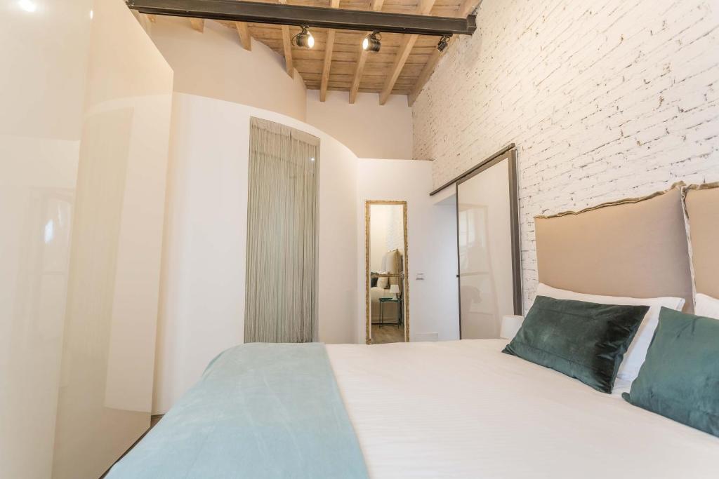 Łóżko lub łóżka w pokoju w obiekcie Casa Manara in Trastevere