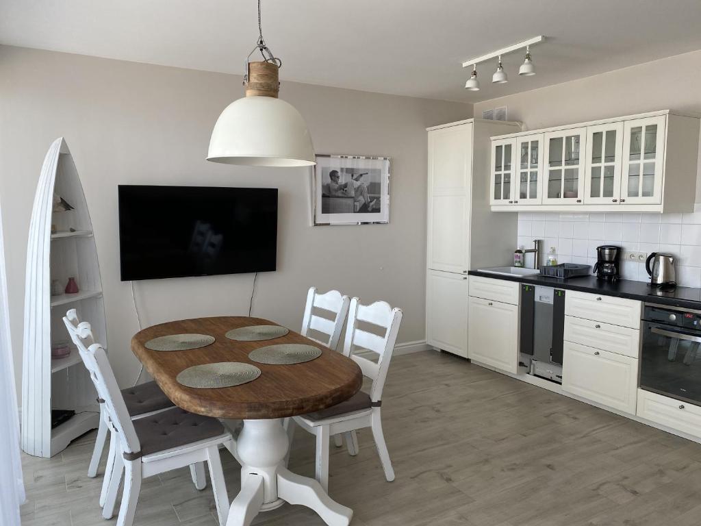 Kuchyň nebo kuchyňský kout v ubytování Apartamenty AMALIA