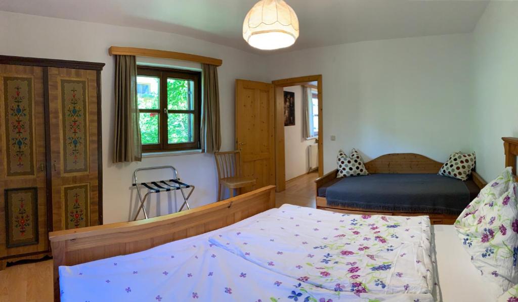 Postel nebo postele na pokoji v ubytování Apartment Sophia - Hallstatt