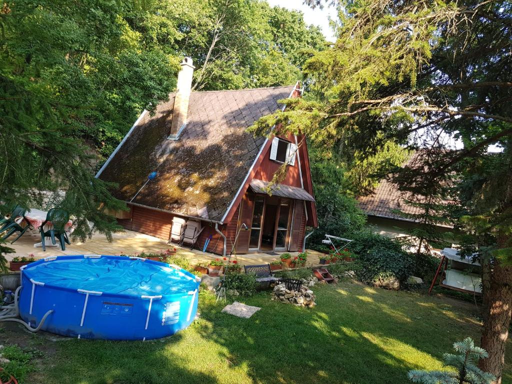 an aerial view of a house with a hot tub in the yard at Cabin in the woods in Budapest