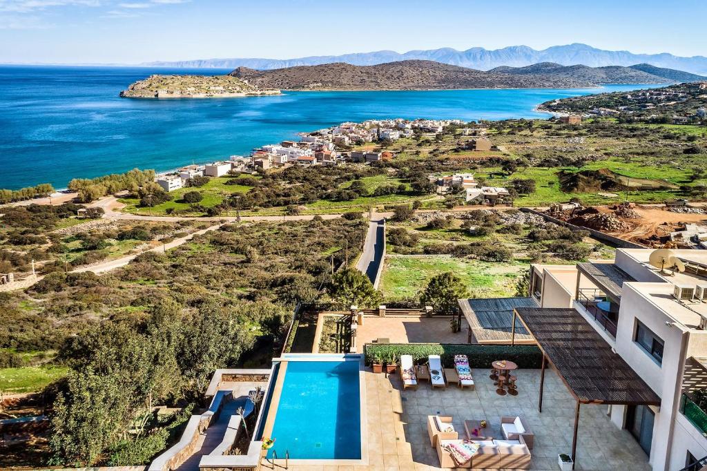 an aerial view of a villa and the ocean at villa Thalia - Panoramic Sea and Mountains Vew Private pool in Kalidhón