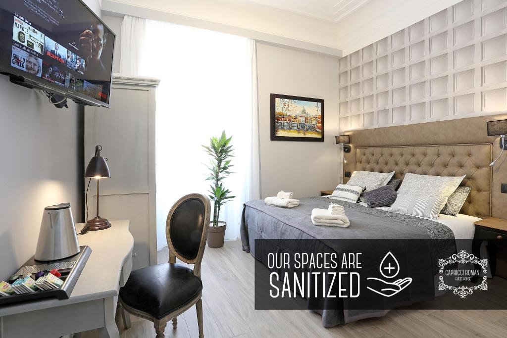 Postel nebo postele na pokoji v ubytování Capricci Romani