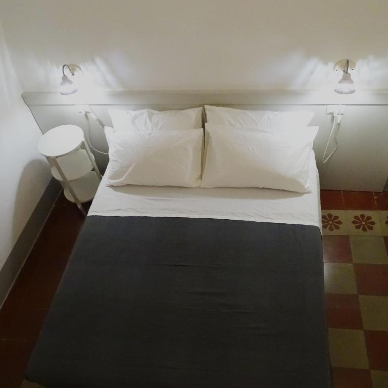 Posteľ alebo postele v izbe v ubytovaní Le Finestre Su Porta Carrese - Luxury Rooms