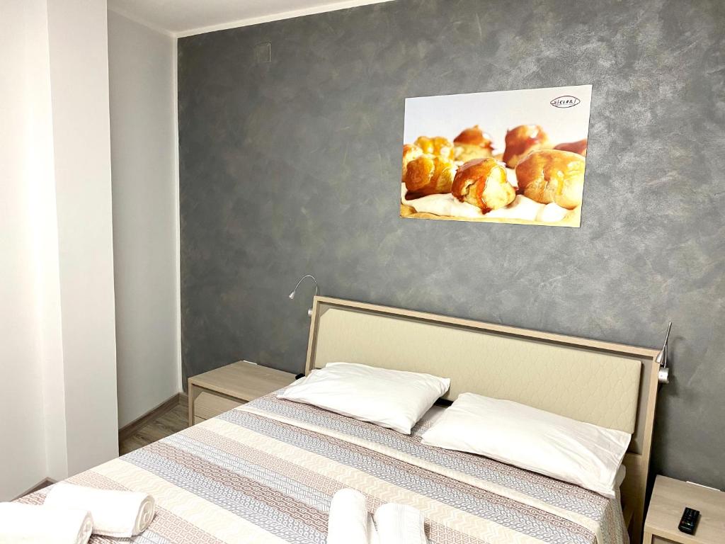 Postel nebo postele na pokoji v ubytování Siclari B&B-Rooms&Suite