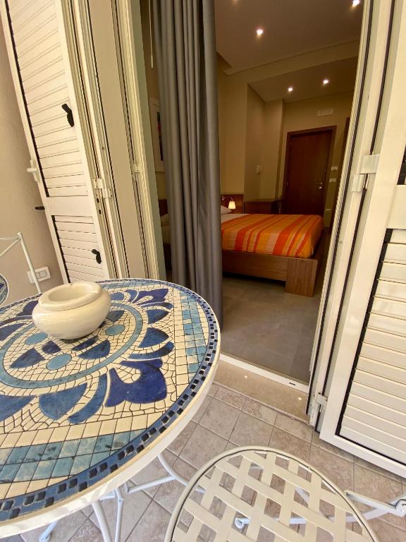 Postel nebo postele na pokoji v ubytování B&B Don Savè