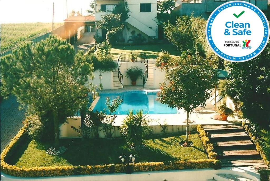 an overhead view of a swimming pool in front of a house at Villa d'Arcos in Arcos