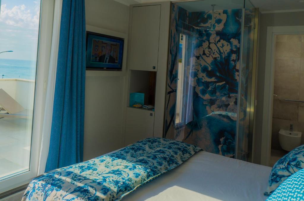 Postel nebo postele na pokoji v ubytování Piccolo Hotel