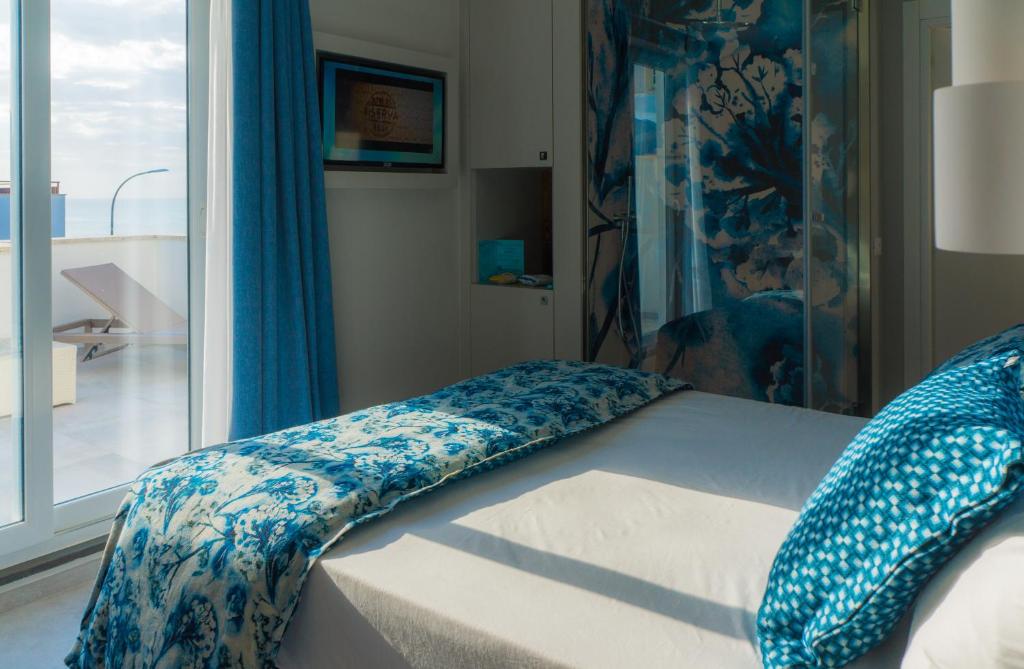 Postel nebo postele na pokoji v ubytování Piccolo Hotel