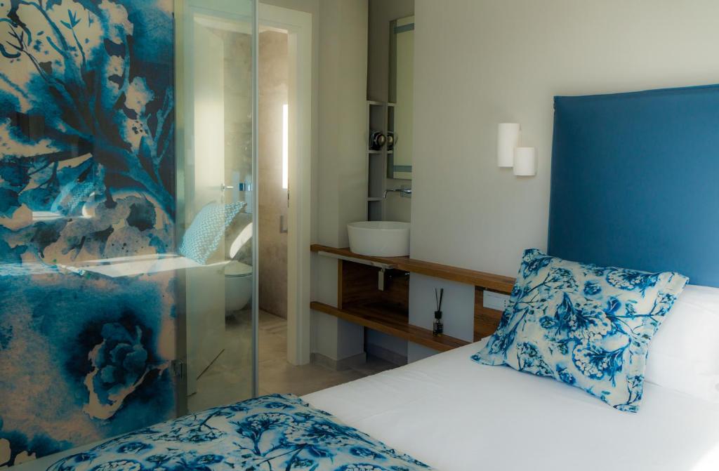 Postel nebo postele na pokoji v ubytování Piccolo Hotel