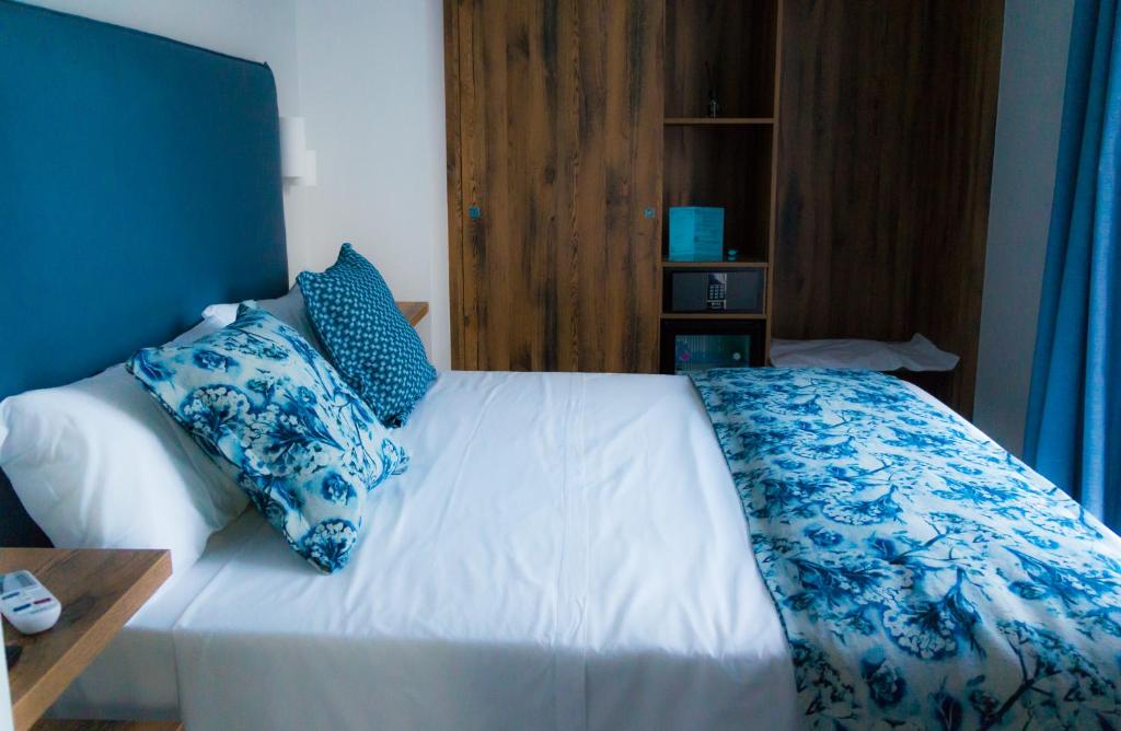 Postel nebo postele na pokoji v ubytování Piccolo Hotel
