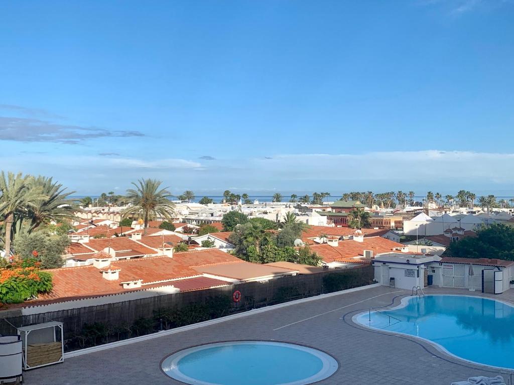 arial view of a city with two swimming pools at Tamarán 309 in Playa del Ingles