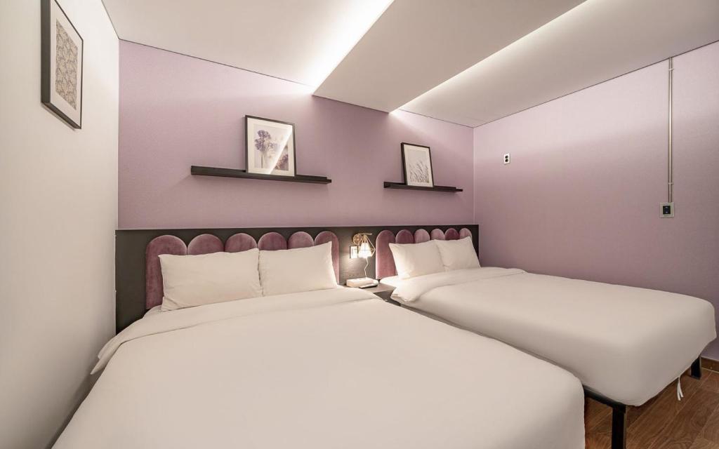 Postel nebo postele na pokoji v ubytování Hotel Hyggelig