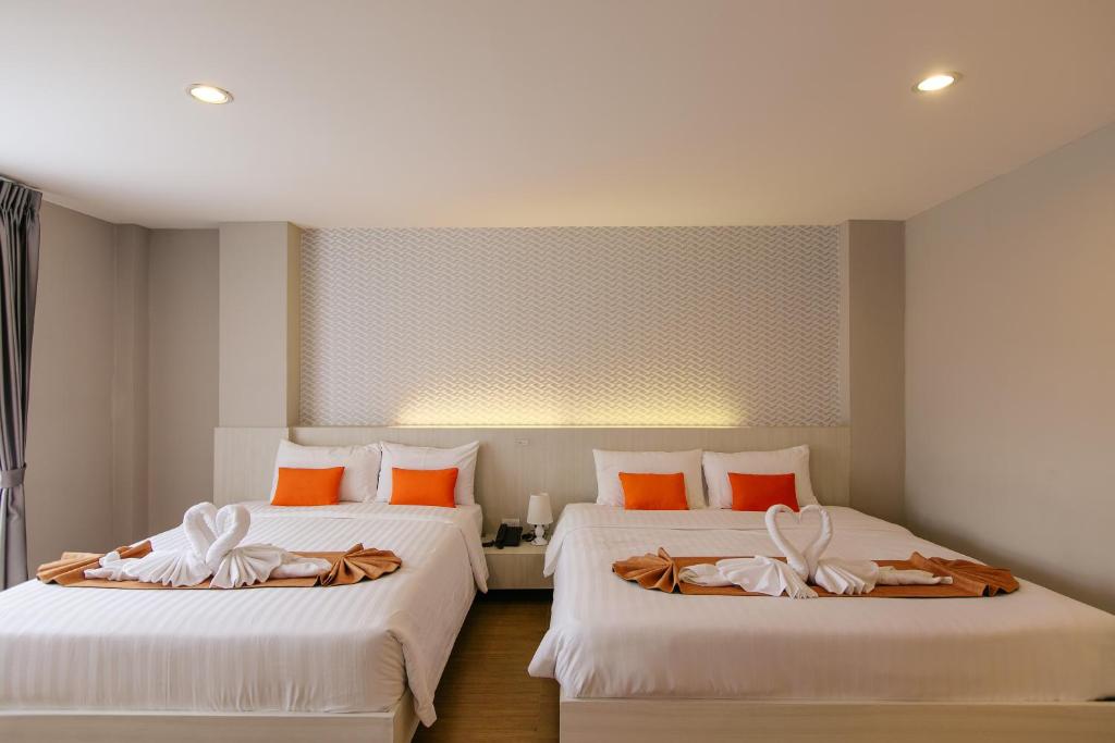 Postel nebo postele na pokoji v ubytování De Hug Hotel & Residence