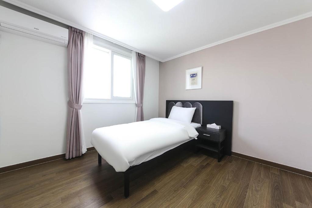 Postel nebo postele na pokoji v ubytování Hotel Hyggelig