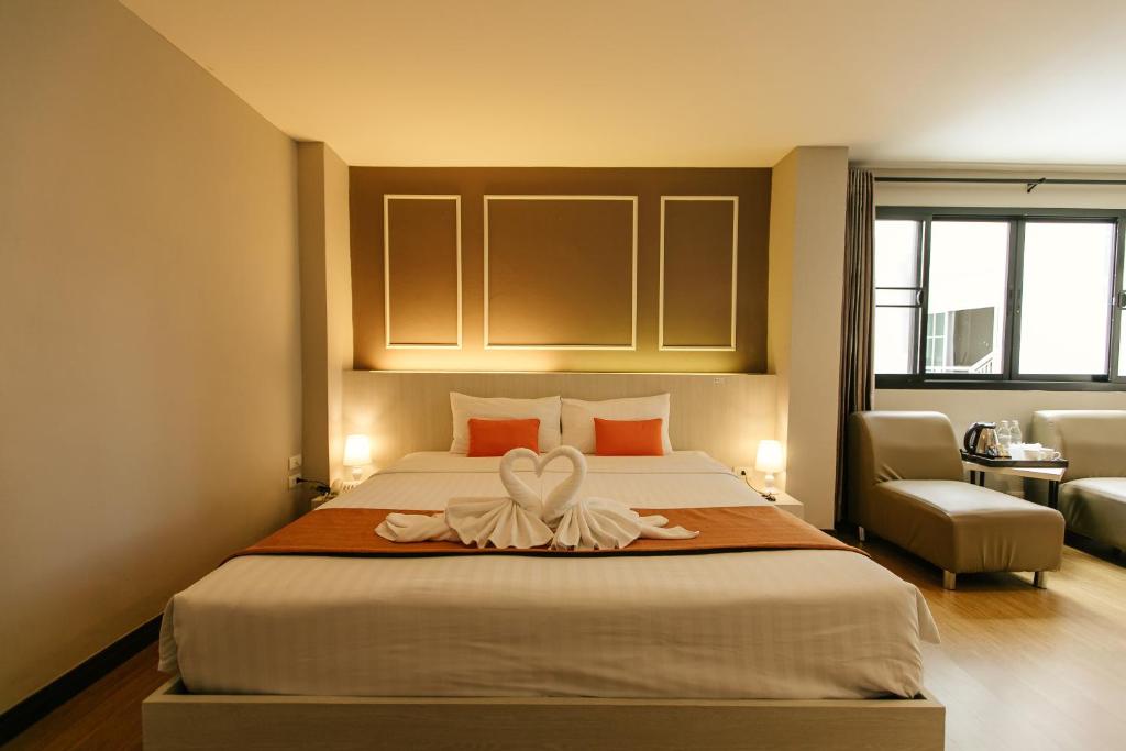 Postel nebo postele na pokoji v ubytování De Hug Hotel & Residence