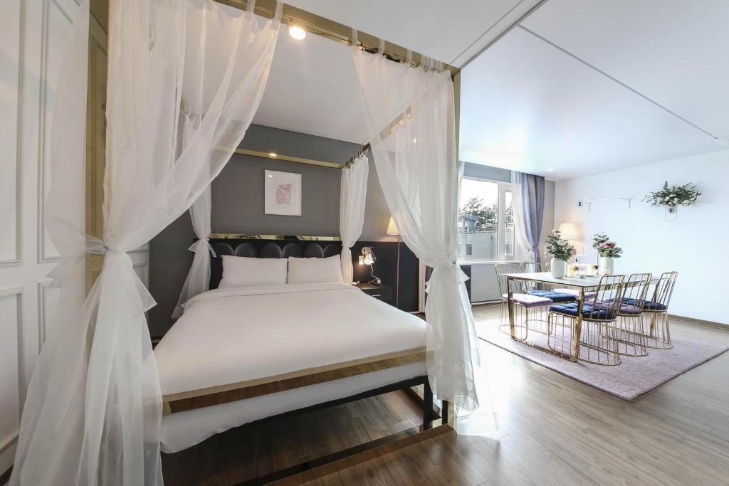 Postel nebo postele na pokoji v ubytování Hotel Hyggelig