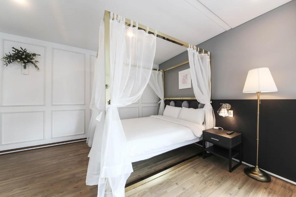 Postel nebo postele na pokoji v ubytování Hotel Hyggelig