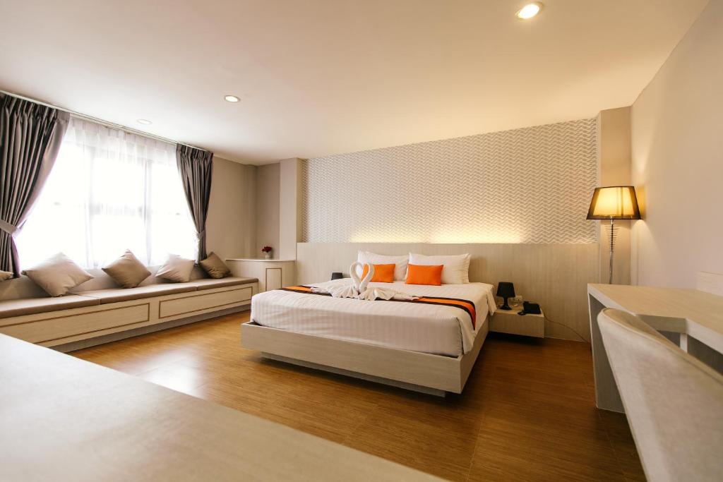 Postel nebo postele na pokoji v ubytování De Hug Hotel & Residence