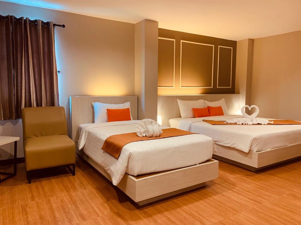 Postel nebo postele na pokoji v ubytování De Hug Hotel & Residence