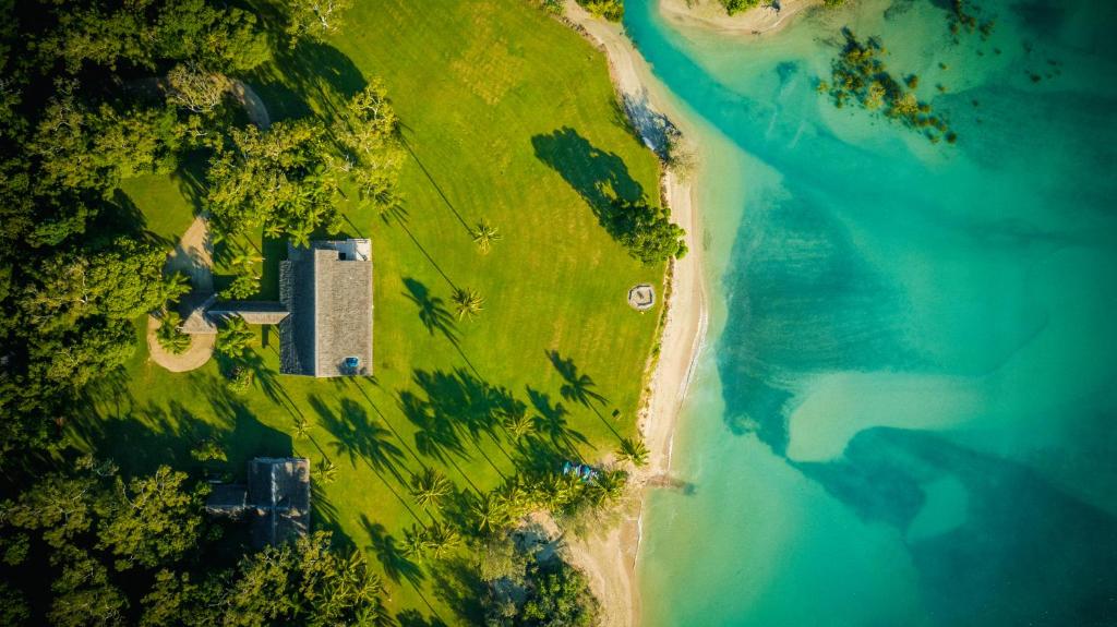 an overhead view of a beach and the ocean at Paradise Cove Villa in Airlie Beach