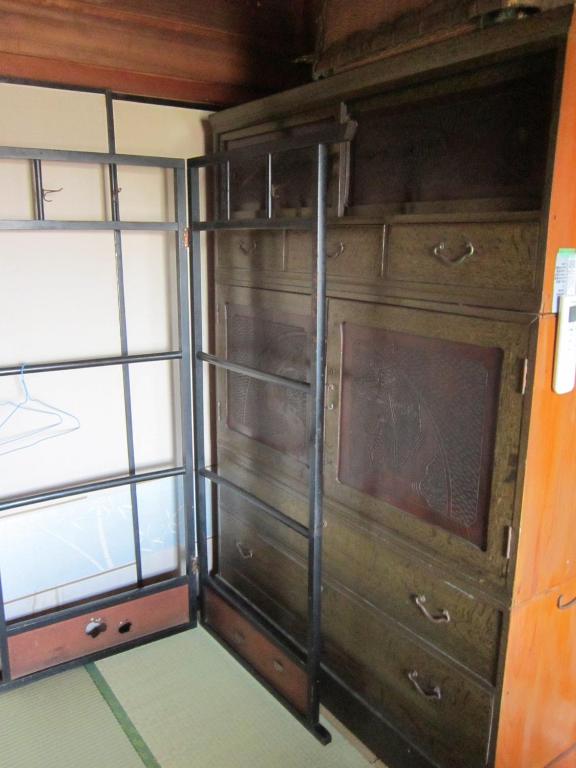 Palanda nebo palandy na pokoji v ubytování Guesthouse Kotohira
