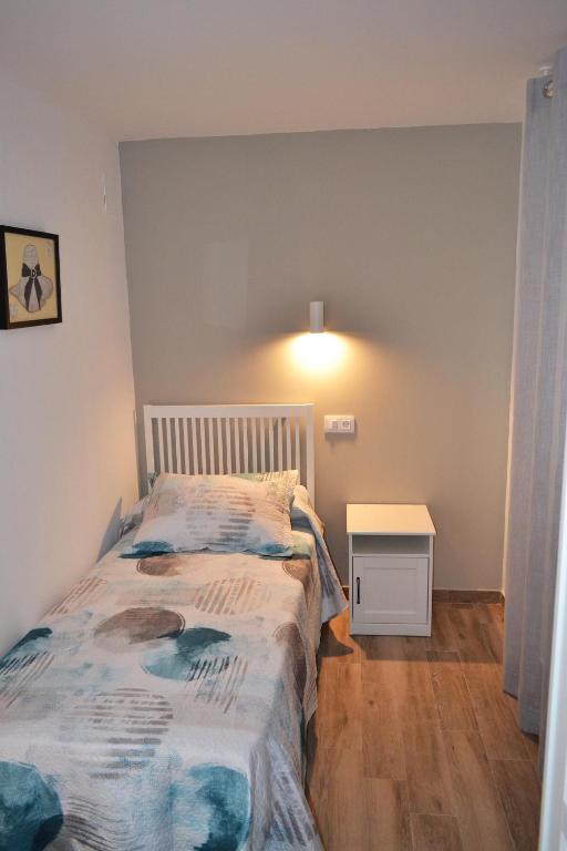 Postel nebo postele na pokoji v ubytování CASA SOLORGA - apartamentos rurales