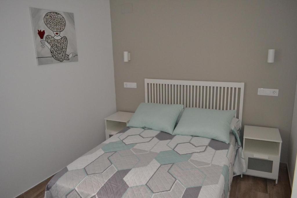 Postel nebo postele na pokoji v ubytování CASA SOLORGA - apartamentos rurales