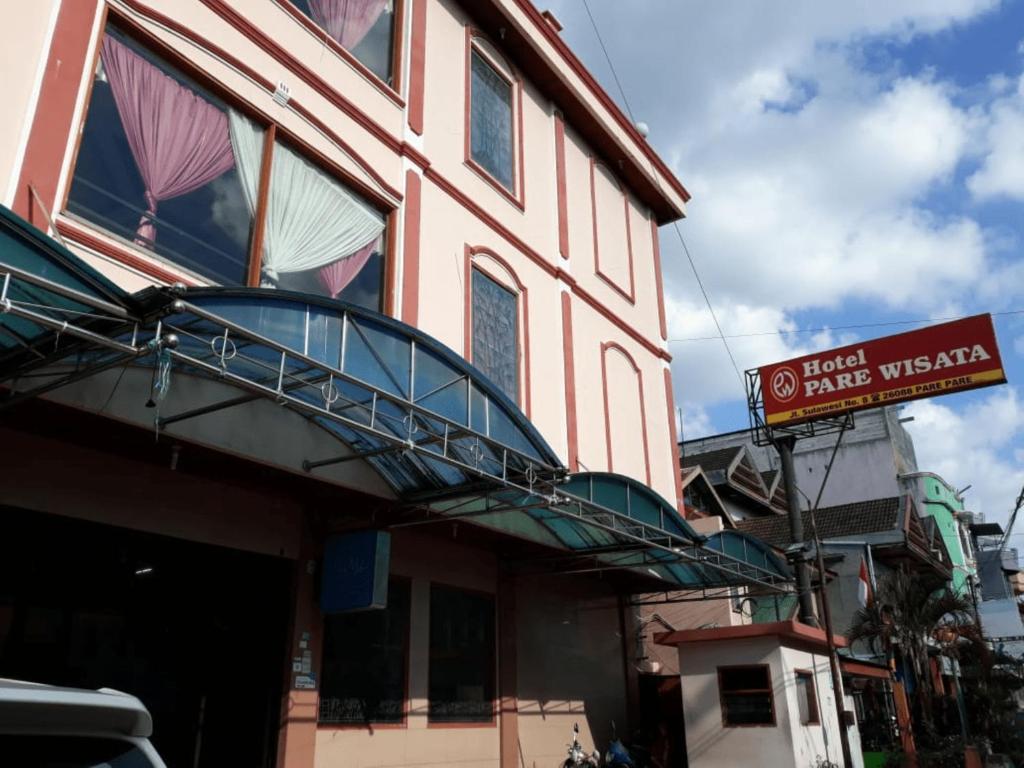 a building with a sign on the side of it at Hotel Parewisata in Parepare