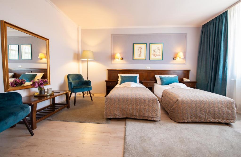 Postel nebo postele na pokoji v ubytování Hotel Wien