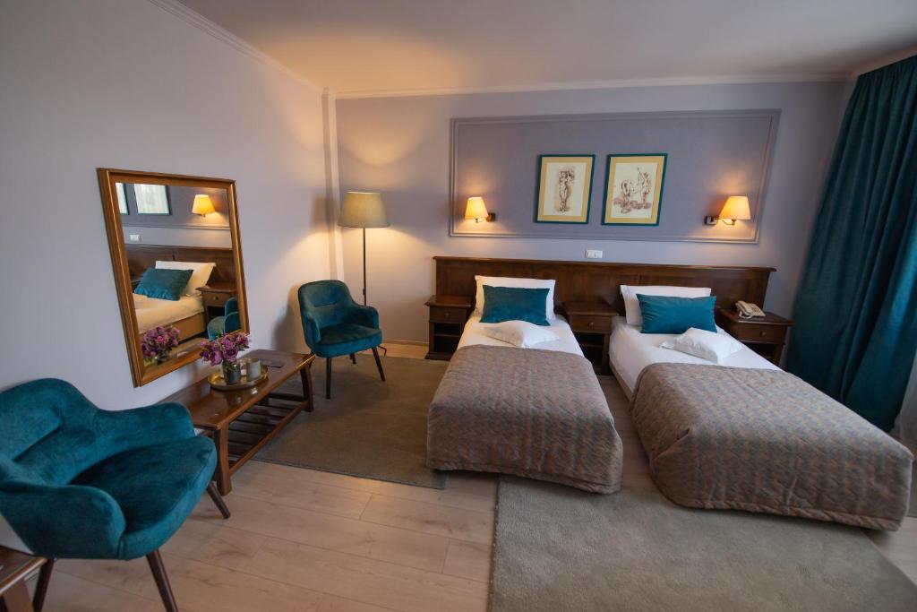 Postel nebo postele na pokoji v ubytování Hotel Wien