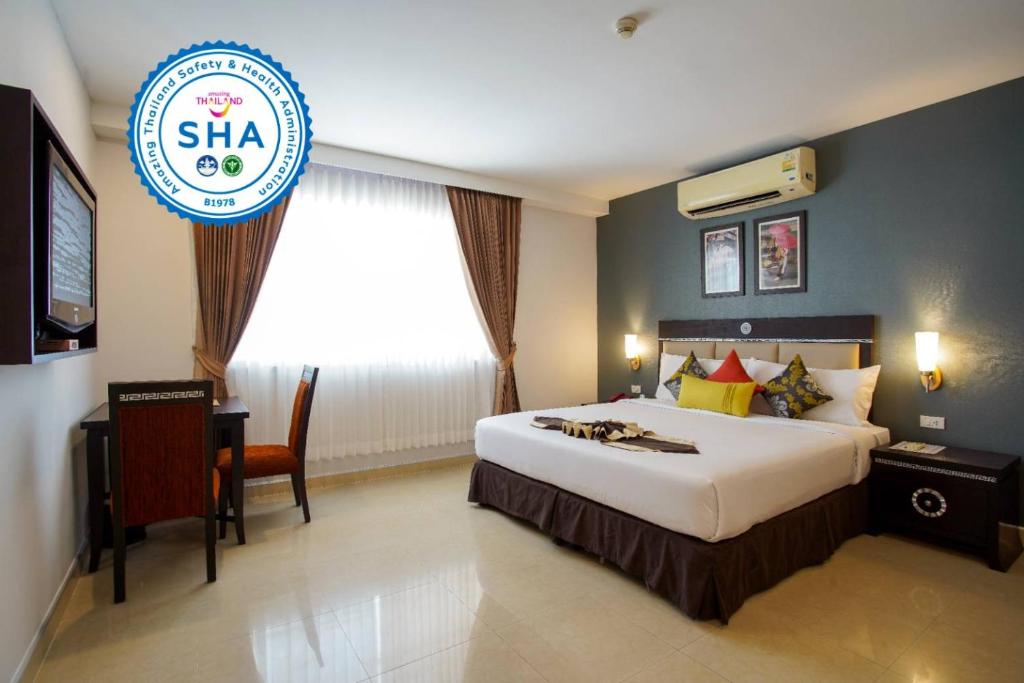 a hotel room with a bed and a sign that says shha at Club Mahindra Mac Boutique Hotel in Bangkok