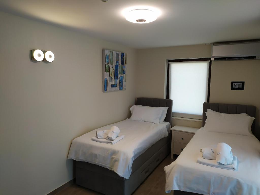 Postel nebo postele na pokoji v ubytování Hotel Petrčane