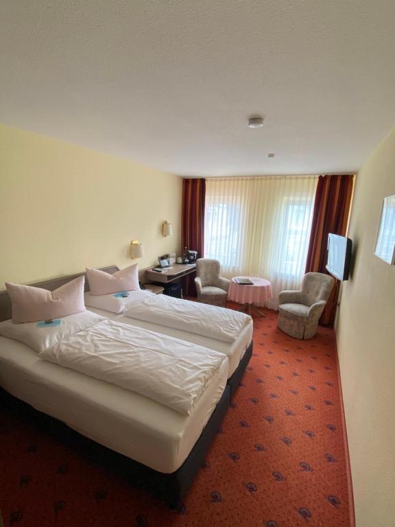 מיטה או מיטות בחדר ב-Hotel Restaurant Ennen