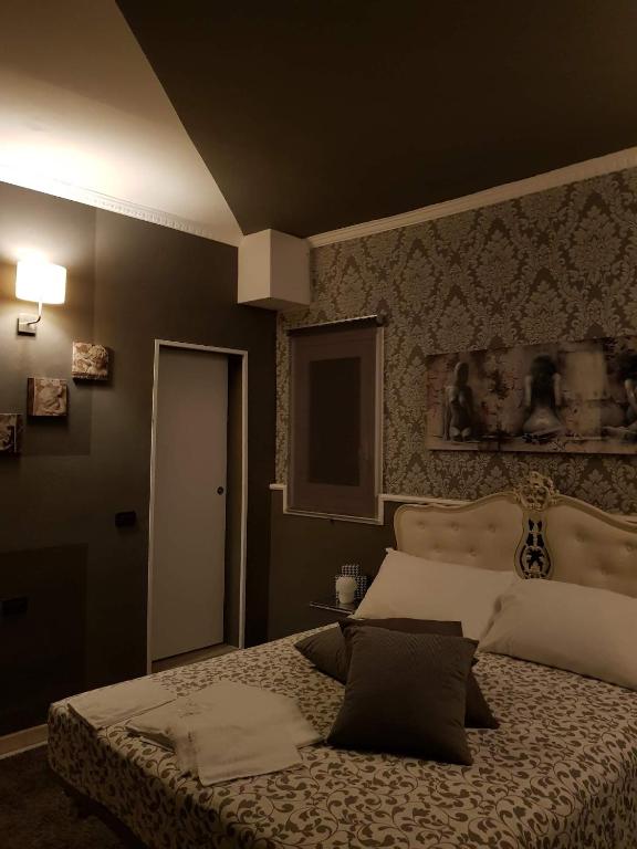 Łóżko lub łóżka w pokoju w obiekcie B&B Villa Rivabella