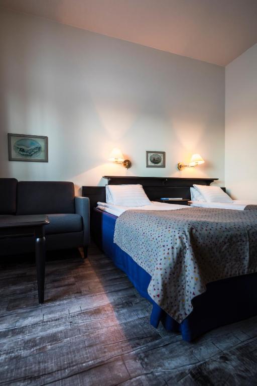 Postel nebo postele na pokoji v ubytování Lapland Hotels Luostotunturi & Amethyst Spa