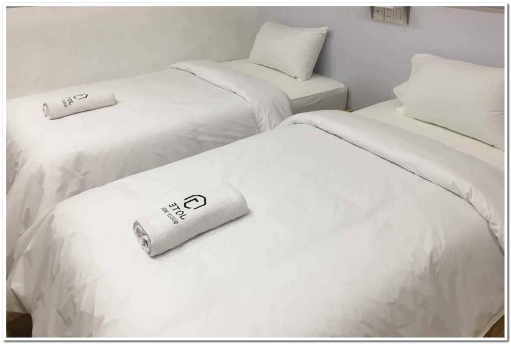 Postel nebo postele na pokoji v ubytování Jotel Guest House Mitra RedDoorz