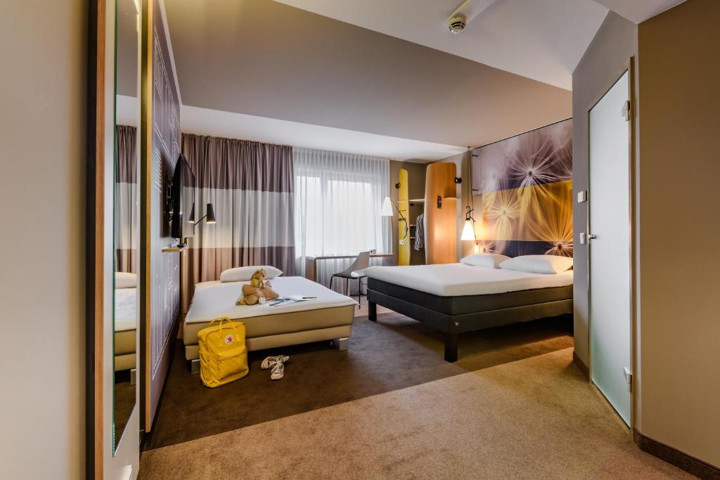 Postel nebo postele na pokoji v ubytování ibis Luebeck City