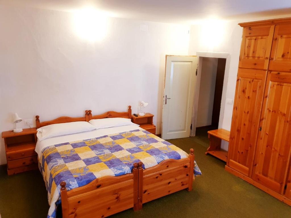 Posteľ alebo postele v izbe v ubytovaní Albergo Trieste